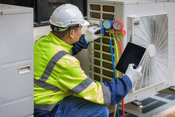 Professional Heat Pump Repair technician working in Aurora, CO